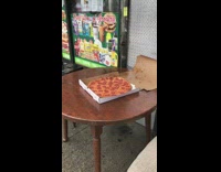 Pepperoni pizza left out in rain table 