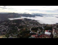 Collab DailyDoseOfInternet - View of city partially covered by the white clouds