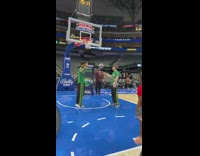 Girl shoots and makes basketball in hoop 