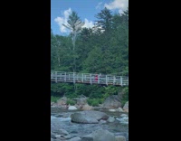 Red dress hat girl bridge river water