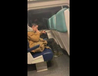 Man picks his nose on the subway 