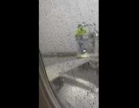 Airplane wings get deiced on the runway