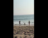 Black shirt mermaid tail girl beach shore