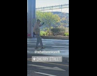Brown jacket older guy sword red tassel 