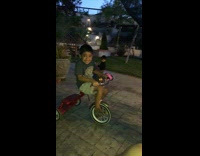 Little boy rides tricycle, gets hit in the face by soccer ball and cries