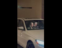 Two women seflie inside the car at the parking lot