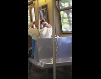Man white blue jacket shaves head bald with razor on metro train 