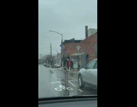 Guy riding bike with a very tall bike seat 
