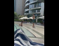 Woman in bikini poses at the swimming pool stairs Part 3