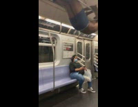 Shirtless guy hangs subway hand rail boots  