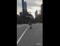 Guy wearing brown wings rides onewheel street 