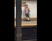 Man in clown makeup at the subway