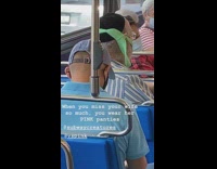 Guy green underwear as face mask bus 