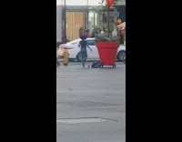 Woman in black top tiktok dance on the street