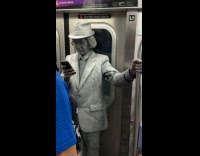 Mime riding the subway 