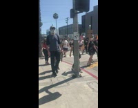 Friend records girl marching protest blm sign 