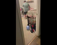 Dad dry heaving from smell while changing baby diapers