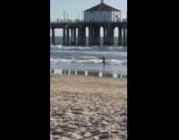 Girl bikini run towards beach pier boyfriend