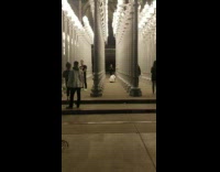 guy films dance between lamps