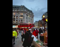 Collab IITW - Woman takes pictures newspaper stand