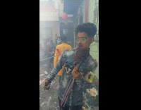 Guy light fireworks on mouth and chest