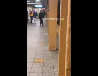 Guy black shorts grey sweatpants subway platform