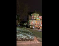 House with Christmas decorations while other only red arrow 