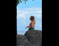 Woman bikini top tiktok dance near pool