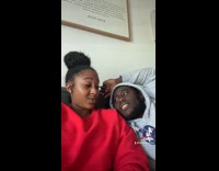 Couple pretend to kiss turn away couch 