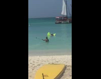 woman in water spin selfie stick