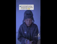 Lady with man filter holds paper in mouth 