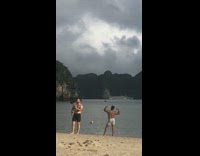 Man grey shorts flex biceps muscles beach