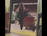 Guy sings on karaoke machine in subway station with woman playing violin