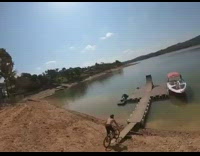 Guy on bike backflips into water 