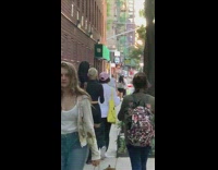 Woman blonde short hair dyes blue smiley happy face on back of head 