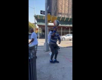 Man stripe shirt spins ball on finger Part 2