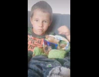 Dog and little boy chills at couch