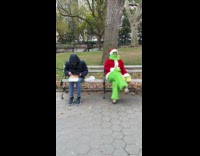 The Grinch sitting eats onion for lunch