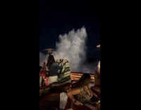 Huge wave reached customers at beach restaurant