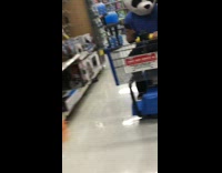 guy blue polo wearing mask riding on cart