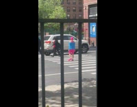 Collab WINY - Tied Lady in Pink Swimwear Crosses Street