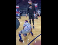 Little 6 year old showing off dribbling skills to globetrotter