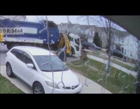 Trash can swallowed by the garbage truck 