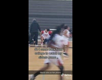 Little sister makes shots at basketball game