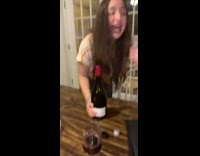 Girls arguing spill wine