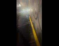 People climb up stairs subway emergency exit