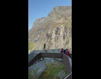 Man tourist stand stairs drone video shoot