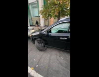 Car with broken tires while engine runs