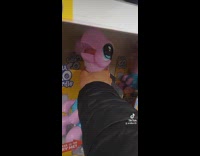 Guy grabs neck of talking turtle toy at store and tells it to shut up