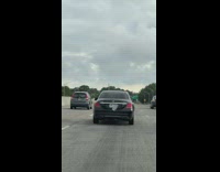 Corner of license plate Falls off black car